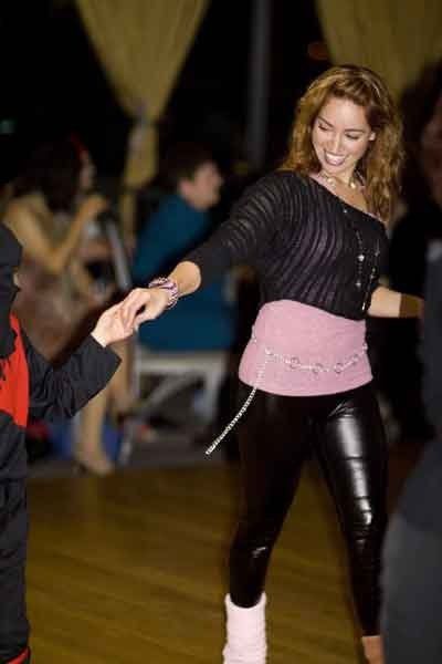 Jaklyn Royal smiling while leading a relaxed social dance